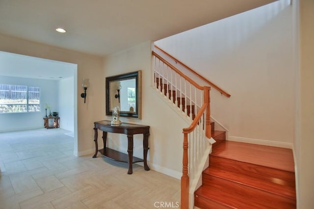 staircase with wood-type flooring