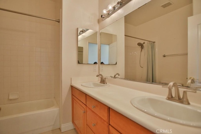 bathroom featuring shower / tub combo with curtain and vanity