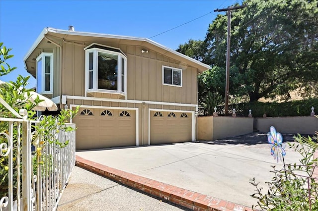 view of side of home featuring a garage