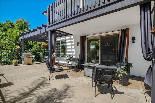 view of patio featuring a pergola, grilling area, and a balcony