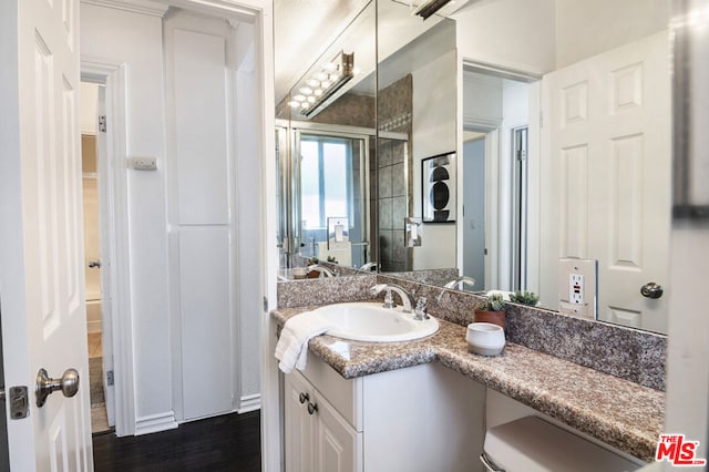 bathroom with wood-type flooring and vanity