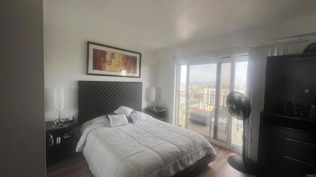 bedroom featuring access to exterior and wood-type flooring