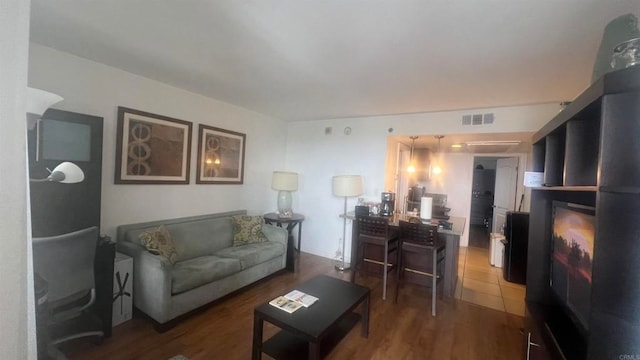 living room with dark hardwood / wood-style floors