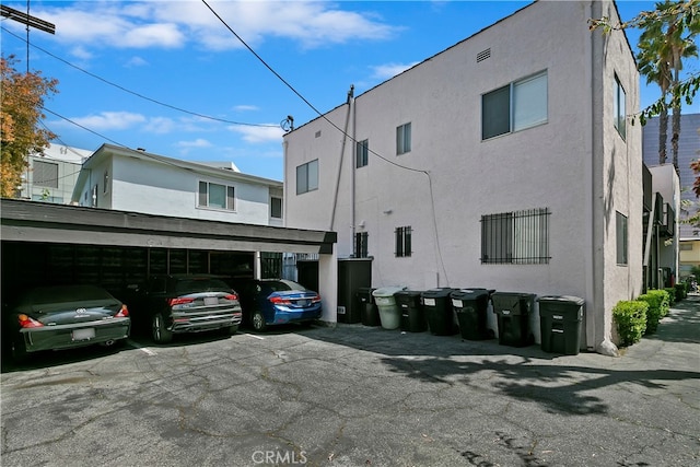 exterior space with a carport