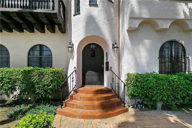 entrance to property with a balcony