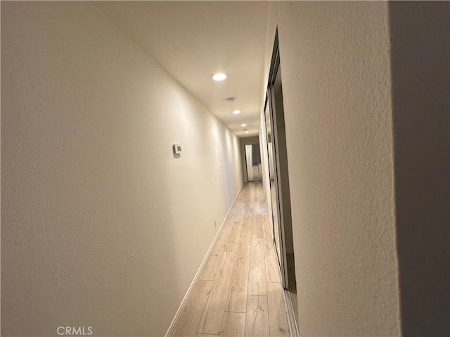 hall with light wood-type flooring