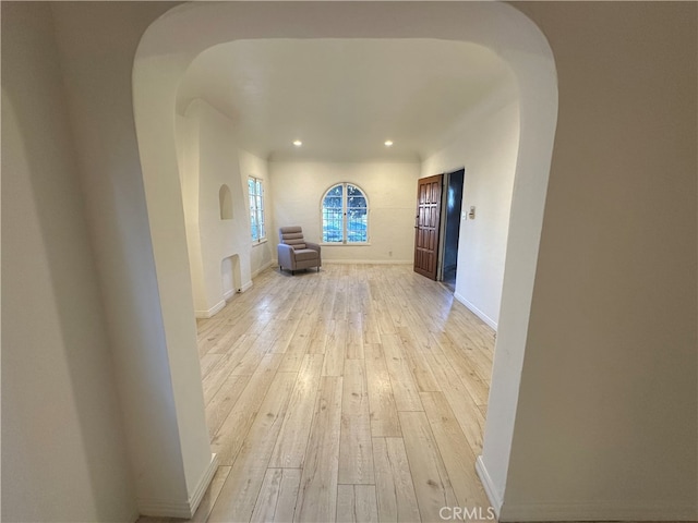 hallway with light wood-type flooring