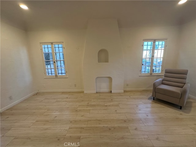 unfurnished room with light wood-type flooring