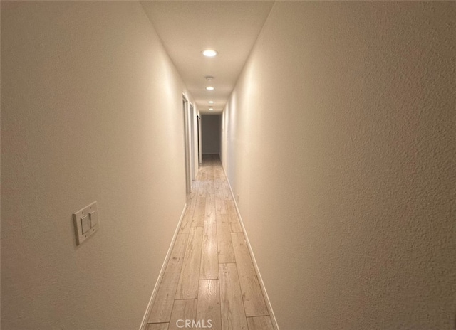 hall with light hardwood / wood-style flooring