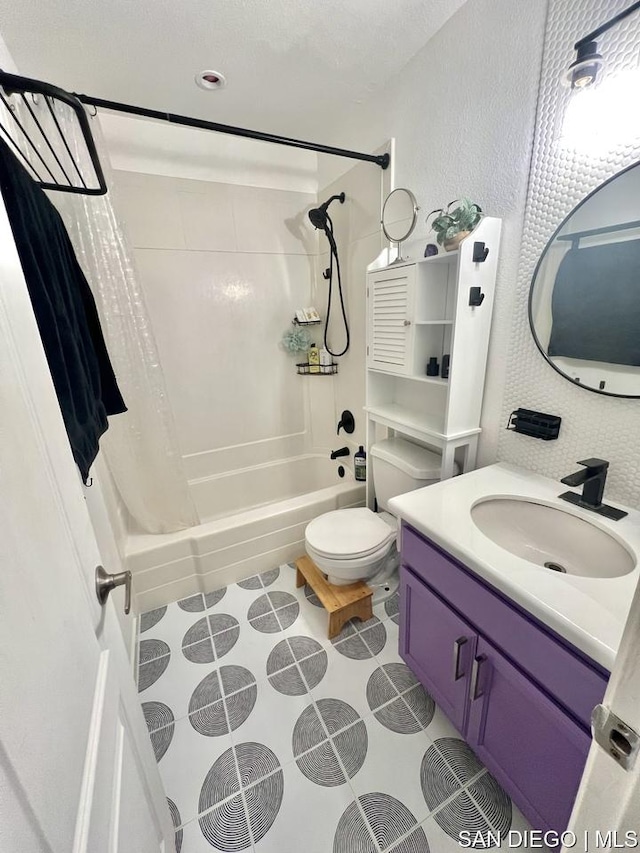 full bathroom featuring vanity, toilet, and shower / tub combo