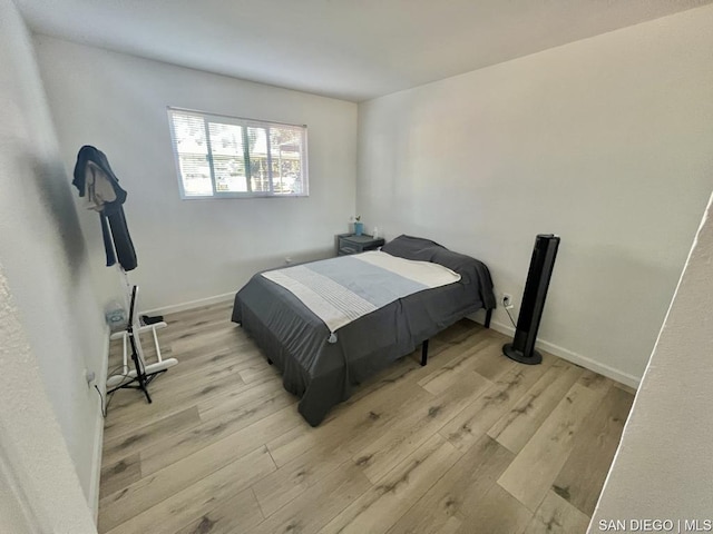 bedroom with light hardwood / wood-style floors