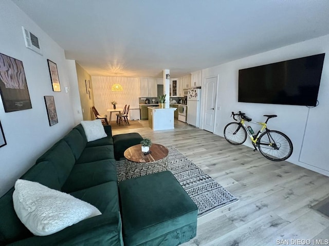 living room with light hardwood / wood-style floors