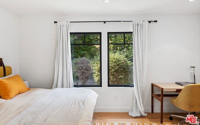 bedroom with light hardwood / wood-style floors