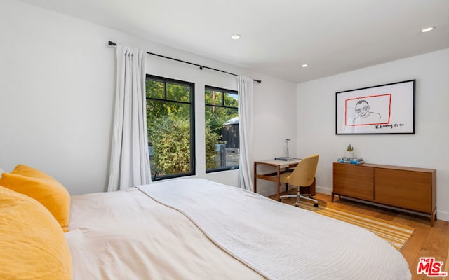 bedroom with light wood-type flooring