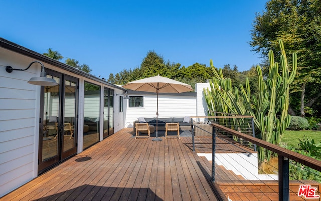 deck with an outdoor living space and french doors