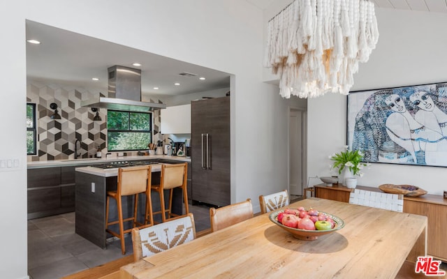 dining space featuring a notable chandelier