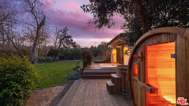 deck at dusk with a lawn