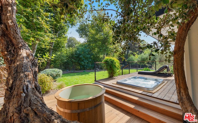 wooden terrace with a yard