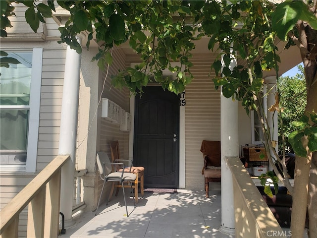 doorway to property featuring a patio area