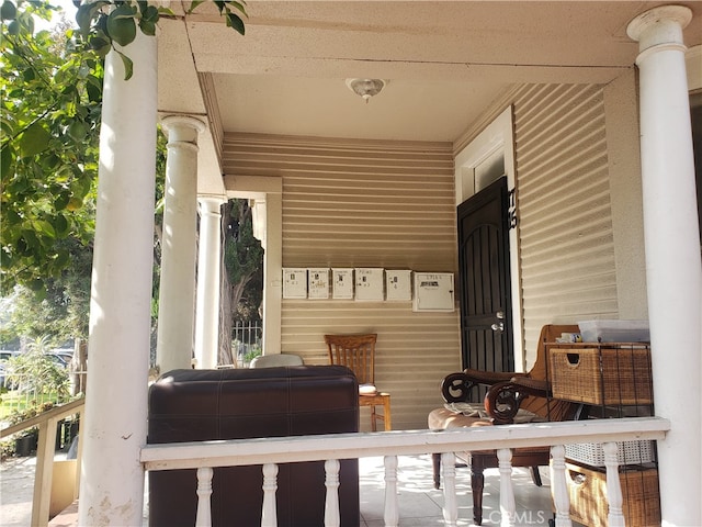 mudroom featuring decorative columns