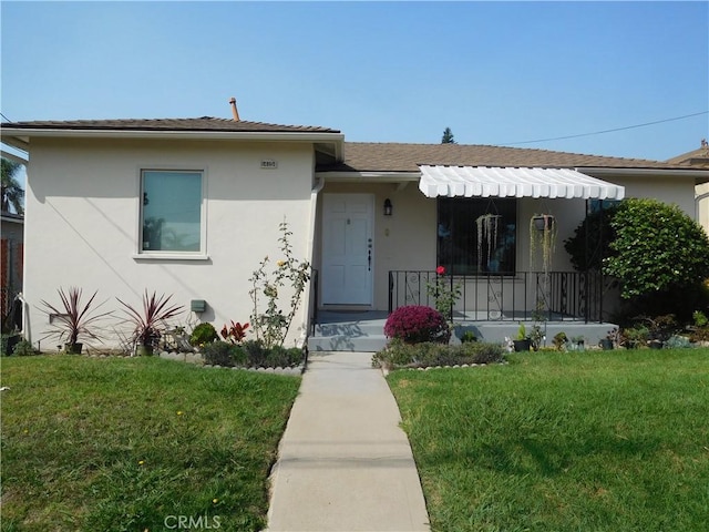 1415 Ximeno Ave, Long Beach, CA 90804 - view of front of house featuring a front lawn, stucco siding, and a porch