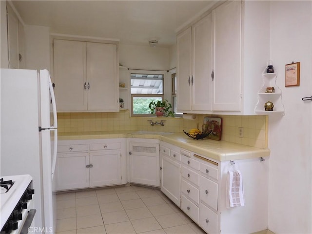 1415 Ximeno Ave, Long Beach, CA 90804 - kitchen featuring open shelves, tile counters, a sink, and white cabinetry