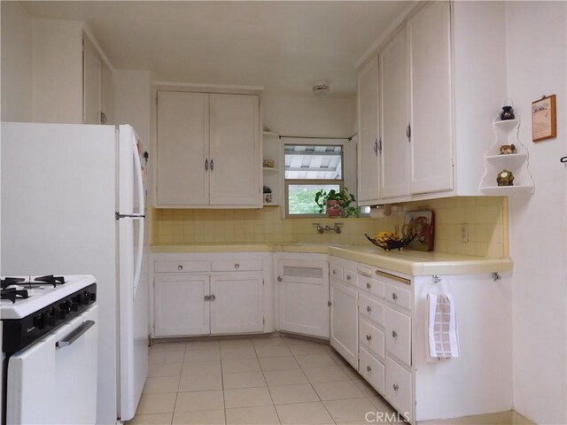 1415 Ximeno Ave, Long Beach, CA 90804 - kitchen featuring open shelves, white cabinets, backsplash, white gas stove, and tile countertops