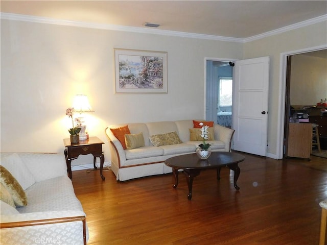 living room featuring crown molding and hardwood / wood-style floors