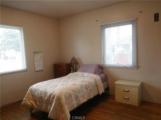 1415 Ximeno Ave, Long Beach, CA 90804 - bedroom with multiple windows and wood finished floors