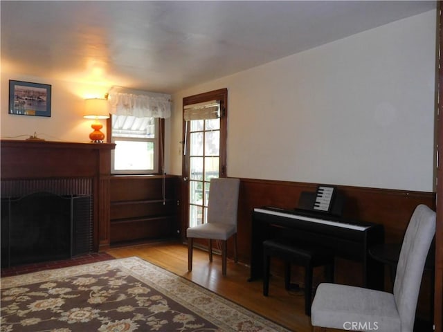 1415 Ximeno Ave, Long Beach, CA 90804 - sitting room with a wainscoted wall, a fireplace, wood finished floors, and wooden walls