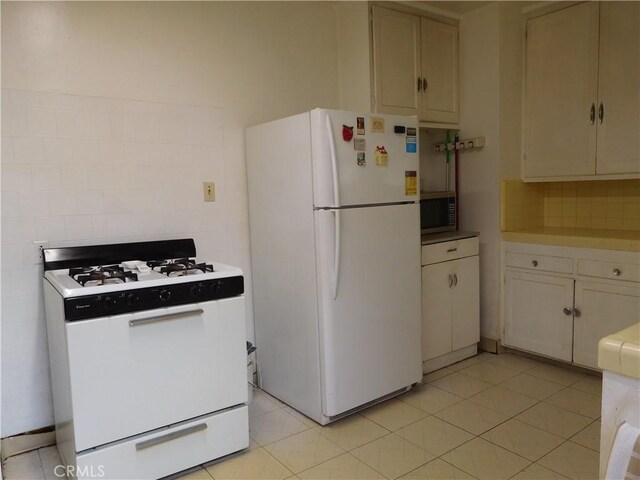 1415 Ximeno Ave, Long Beach, CA 90804 - kitchen featuring white appliances, decorative backsplash, and light countertops