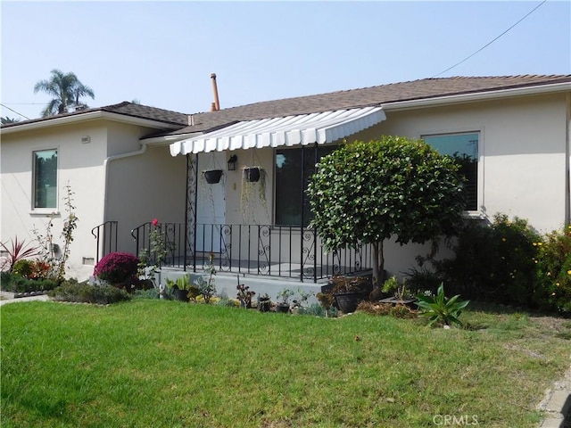 1415 Ximeno Ave, Long Beach, CA 90804 - view of front of property with a front yard, stucco siding, covered porch, and roof with shingles