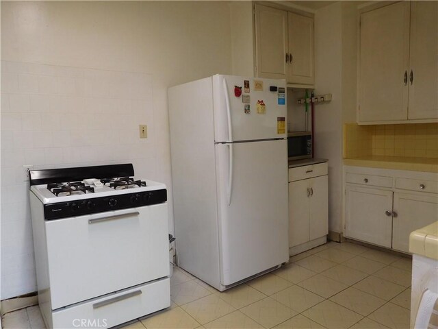 1415 Ximeno Ave, Long Beach, CA 90804 - kitchen with white appliances, backsplash, and light countertops