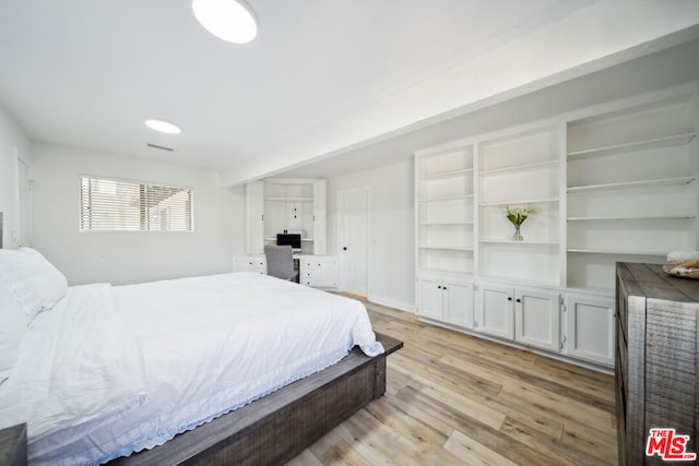 bedroom with light wood-type flooring