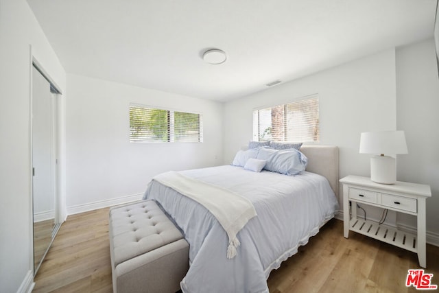 bedroom with light wood-type flooring