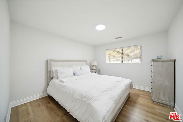 bedroom featuring hardwood / wood-style floors