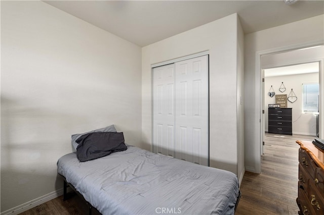 bedroom featuring hardwood / wood-style flooring and a closet