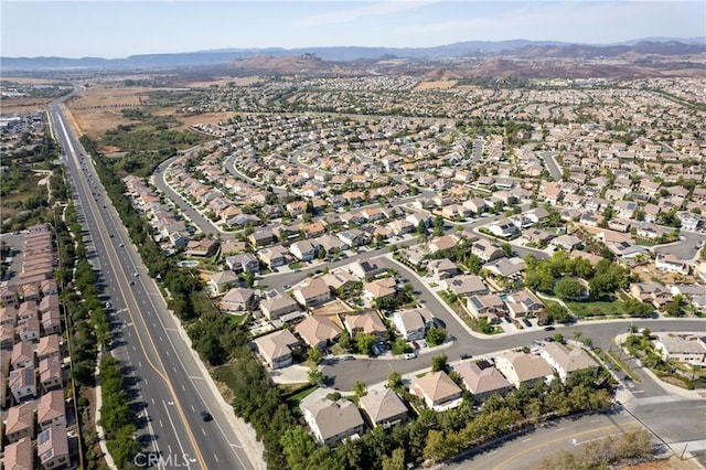 drone / aerial view featuring a residential view and a mountain view