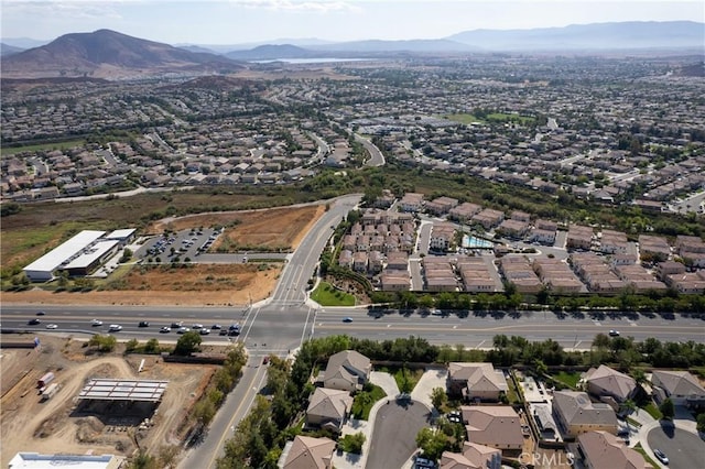 birds eye view of property with a residential view and a mountain view