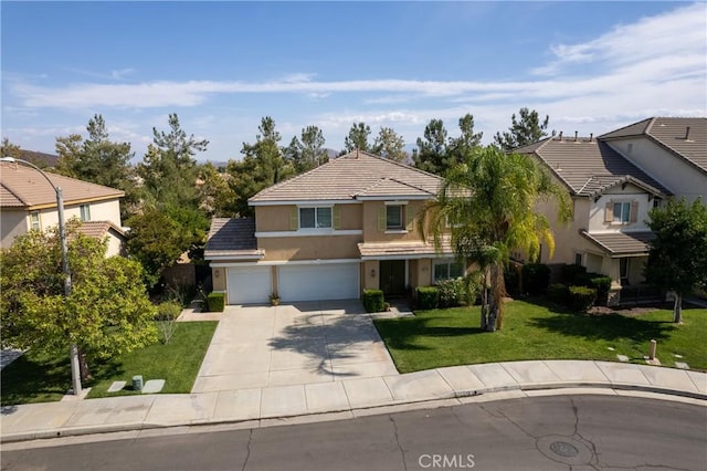 view of front of house featuring stucco siding, a front yard, a garage, a residential view, and driveway