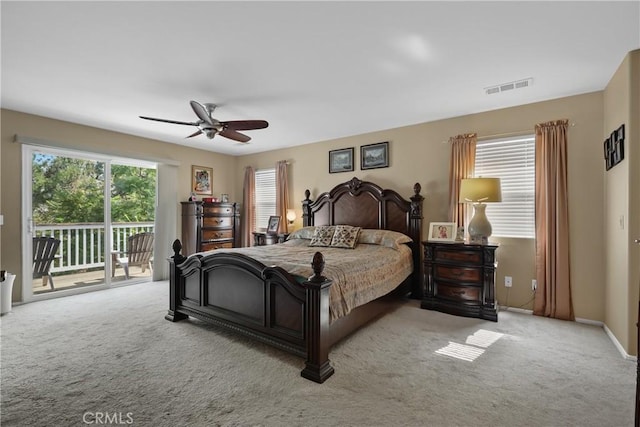 bedroom with access to outside, visible vents, baseboards, and light colored carpet