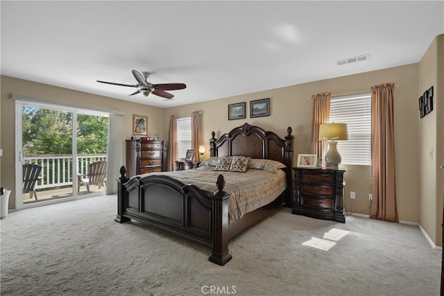 bedroom featuring carpet, visible vents, a ceiling fan, and access to exterior