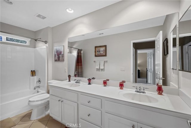 bathroom with visible vents, toilet, tile patterned flooring, shower / bath combination with curtain, and a sink