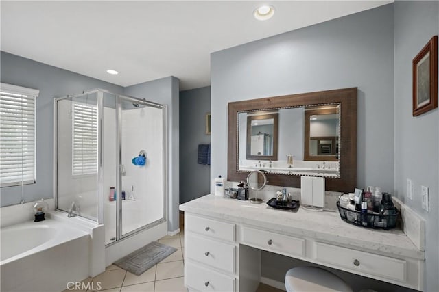 bathroom featuring a bath, tile patterned floors, recessed lighting, a shower stall, and vanity