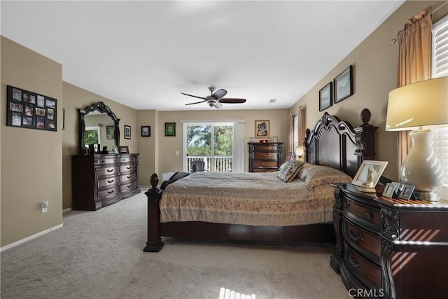 bedroom with a ceiling fan, access to outside, light carpet, and baseboards