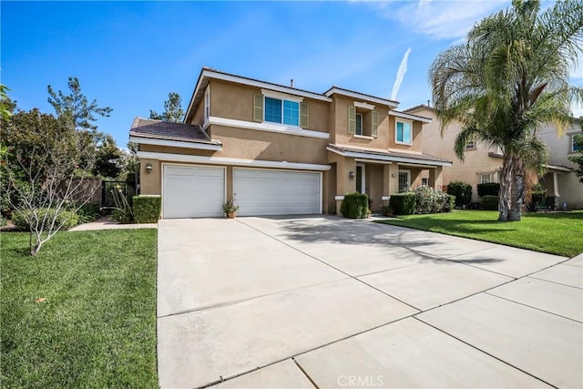 view of front facade featuring a front yard, concrete driveway, an attached garage, and stucco siding