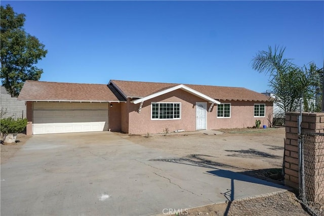 ranch-style house featuring a garage