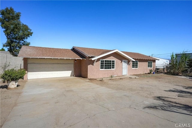 ranch-style home with a garage