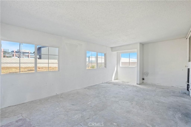 empty room featuring a textured ceiling