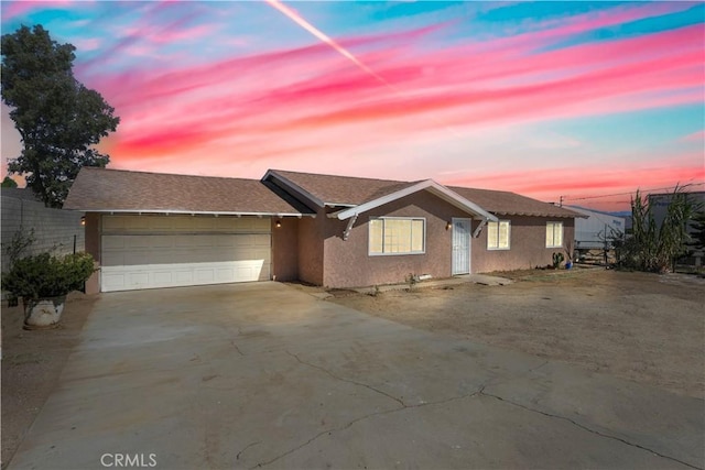 ranch-style home with a garage